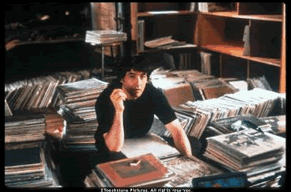 John Cusack in his record store from the movie "High Fidelity", courtesy of Touchstone Pictures